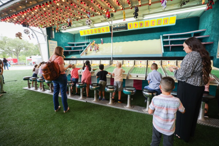 Children racing on the battle bikes tower