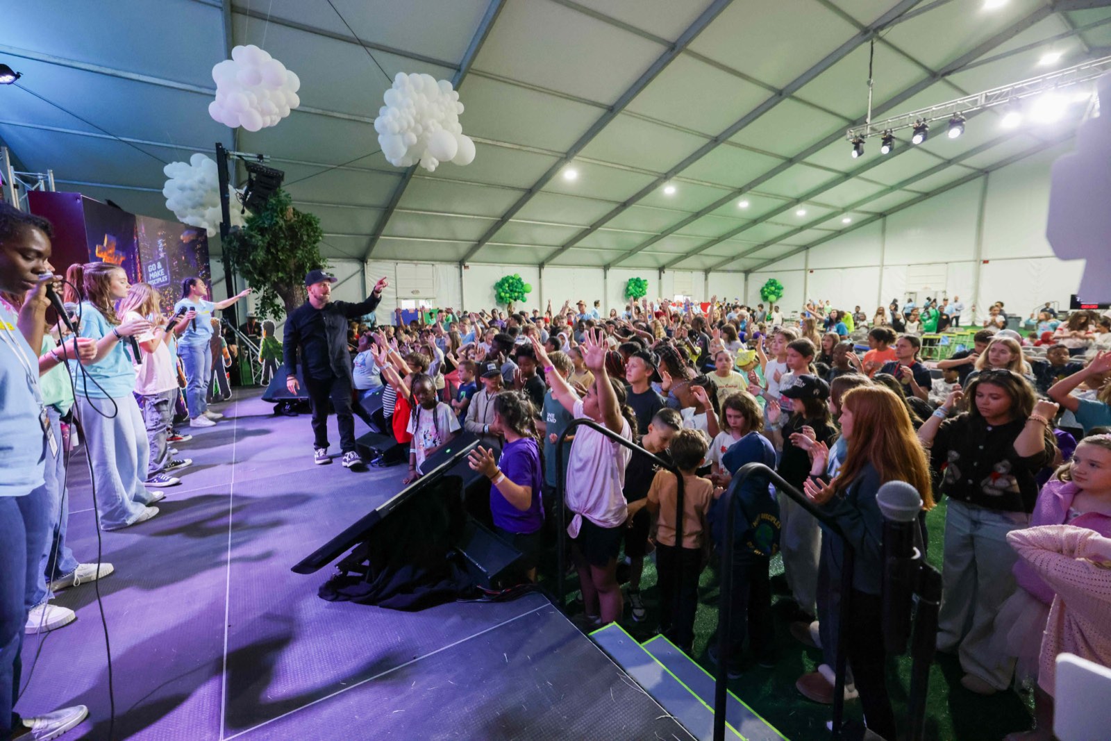 The Kids Week tent packed with children on their feet