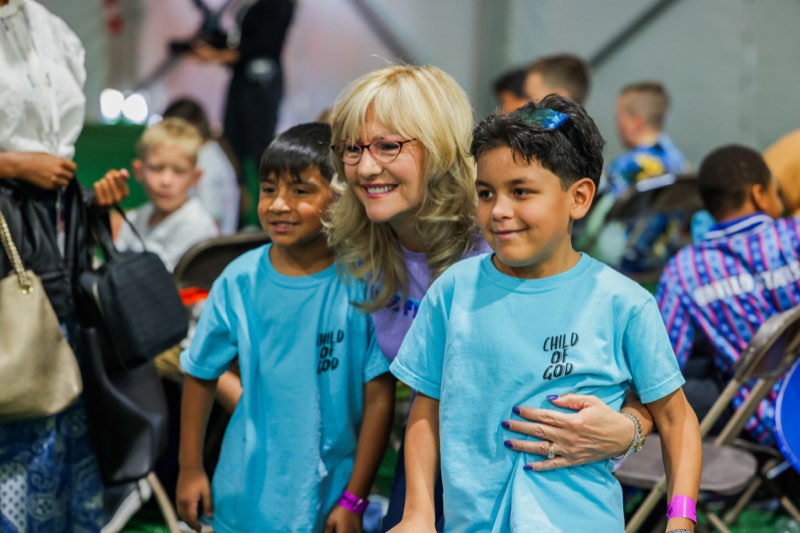 Children arriving for a Kids Week service