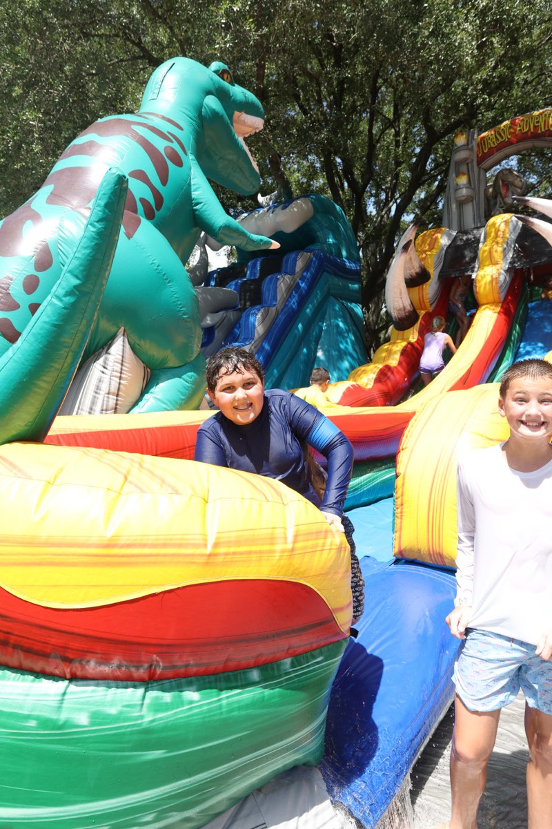 A child on a tall inflatable water slide